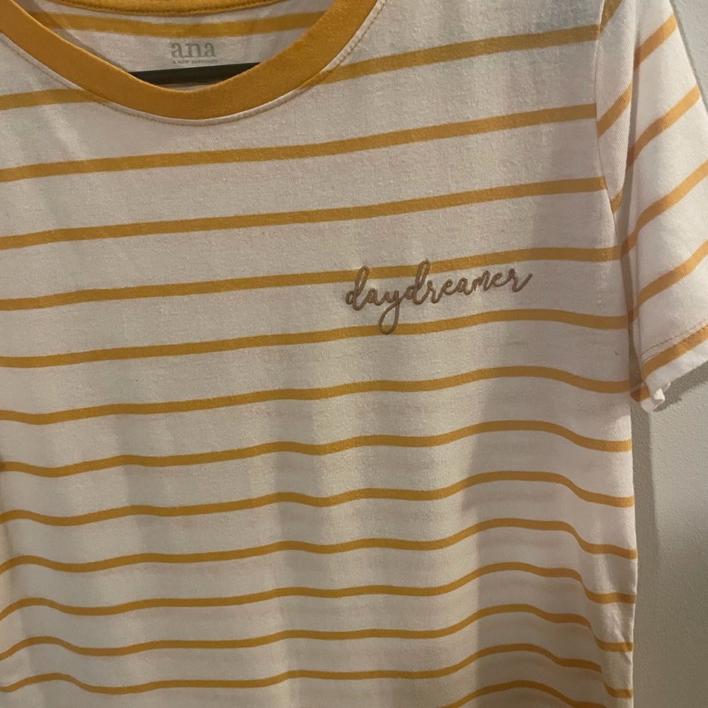 Yellow and white striped shirt in size M.